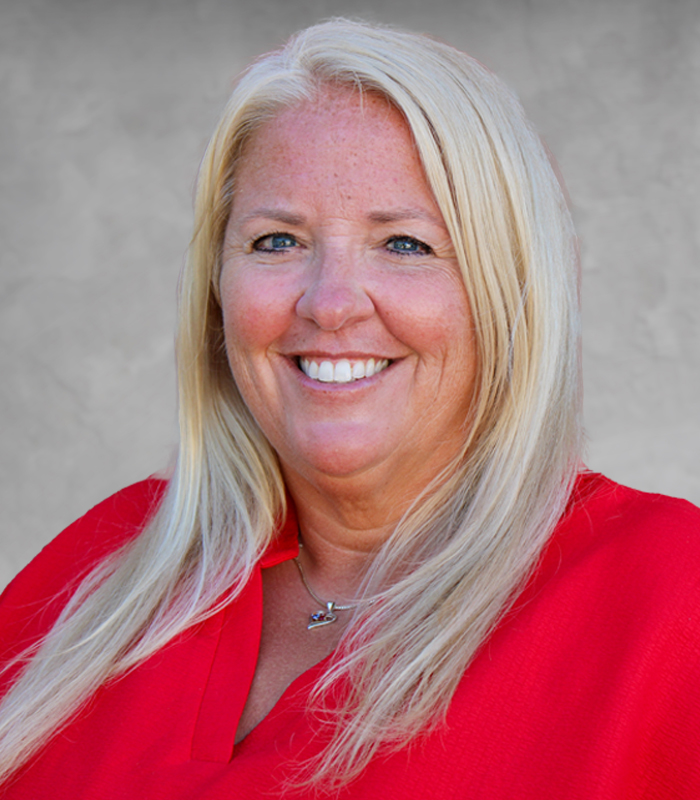 About Our Agency - View of Relion Insurance Solutions Office Building with an Empty Parking Lot and Green Landscaping